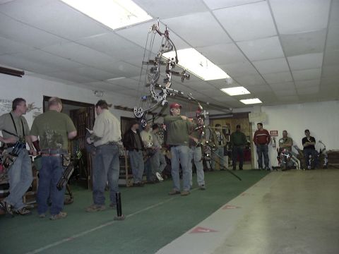 1992 Ford Bronco - Participants in an indoor archery competition take aim with their bows.
