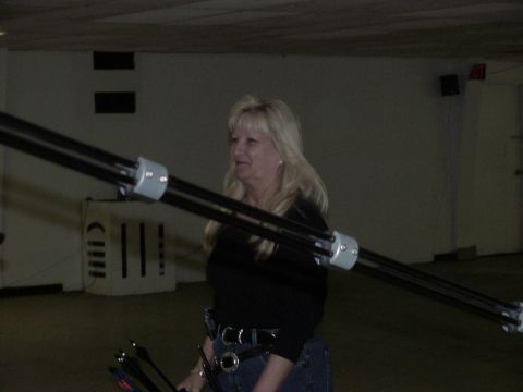 1992 Ford Bronco - Woman holding archery equipment indoors.