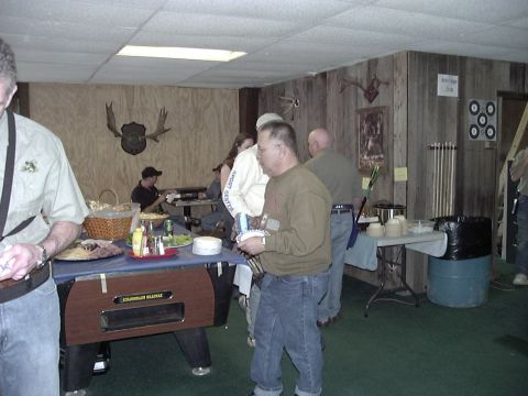 1992 Ford Bronco - Indoor gathering with food spread and pool table, decorated with mounted animal heads.