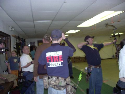 1992 Ford Bronco - Indoor archery range with multiple participants practicing their shots.