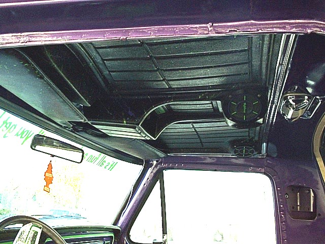 1978 Ford Bronco interior showing headliner, speakers, and rearview mirror