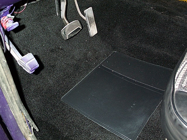 Interior floor with pedals and black floor mat