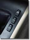 1995 Ford Bronco - Close-up of three dashboard switches with visible text labels.