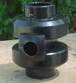 1995 Ford Bronco - A black metal differential lock actuator is shown outdoors against a blurred green background.