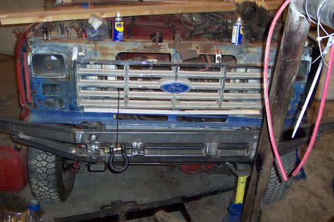 1986 Ford F-250 - Front view of a Ford truck with its grille and bumper removed, showing internal components and repair work.