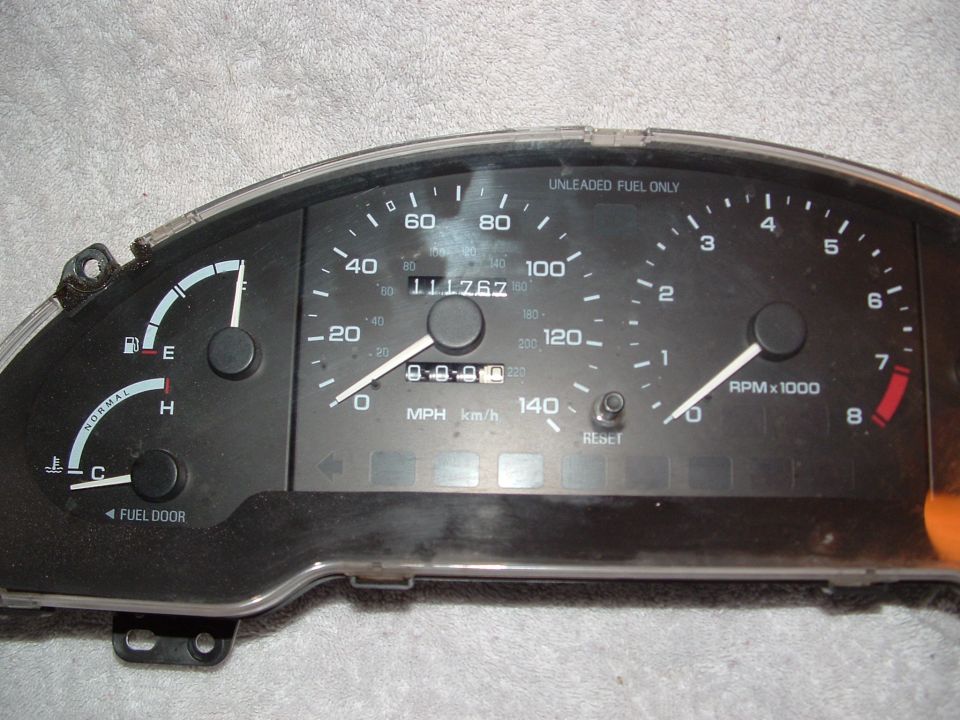 Car gauge cluster with speedometer, tachometer, fuel gauge, and temperature gauge. Odometer shows 111767 miles