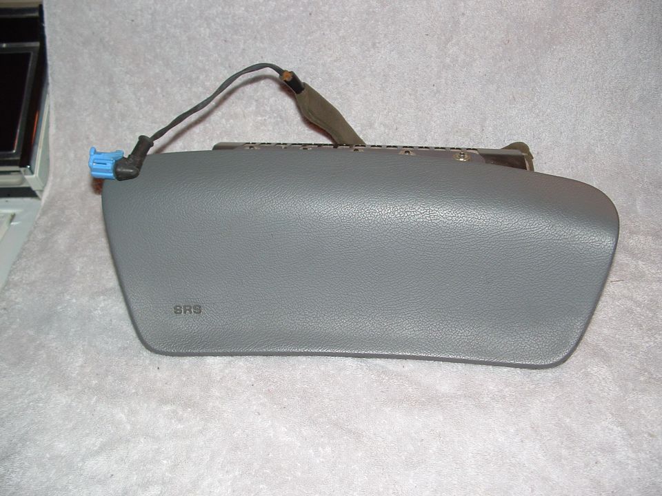 Gray SRS airbag module with blue connector and wiring harness
