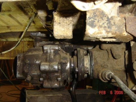 1982 Nissan Titan - Close-up of a vehicle's drivetrain component, showing signs of wear and rust.