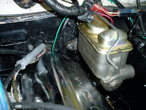 1966 Ford Fairlane - Close-up of brake master cylinder and associated engine bay components.