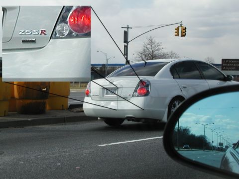 1992 Ford Taurus - A white sedan is seen from the rear, with a close-up inset showing the '2.5SR' badge.
