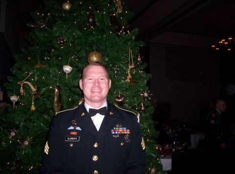 1995 Ford Bronco - A soldier poses for a photo in front of a Christmas tree during a formal event.