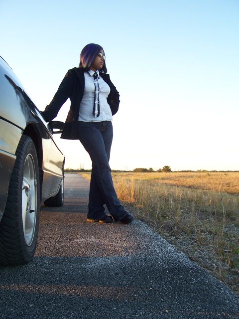 1994 Ford Probe - A person poses with a car on a roadside during a golden hour photo shoot.