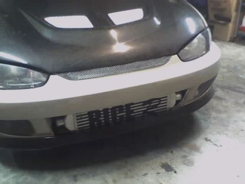 1999 Mitsubishi Mirage - Front view of a 1999 Mitsubishi Mirage with a carbon fiber hood and an exposed intercooler.