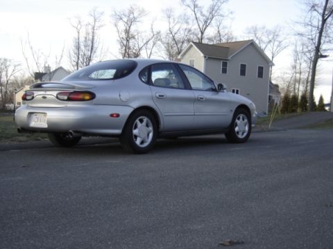 1999 Ford Taurus - Silver 1999 Ford Taurus sedan seen from the rear 3/4 angle.