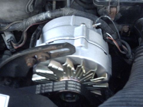 1991 Ford LTD Crown Victoria - Alternator and drive belts in engine bay.