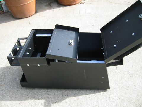1992 Ford Bronco - Black metal storage box with an open lid and a removable tray, a lock mechanism and a Supermotors logo at the bottom right.