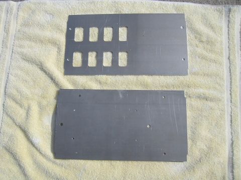 1992 Ford Bronco - Two metal panels with multiple rectangular cutouts are shown, likely for custom switch installations.