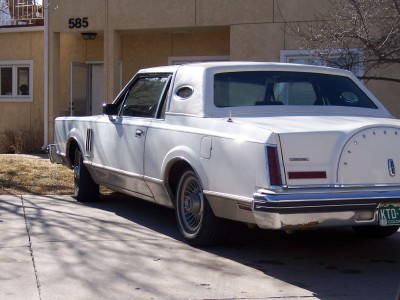 1972 Ford Ranchero - Rear view of a white coupe opera windows and Lincoln script on the trunk lid, likely from the 1970s.