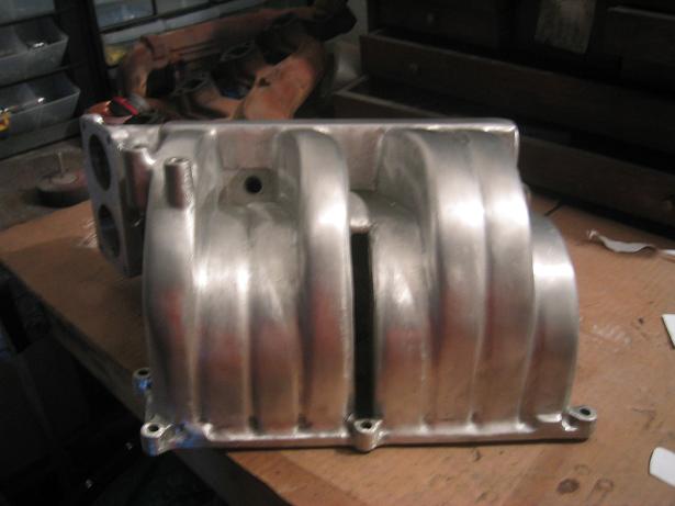 Aluminum intake manifold with ribbed runners