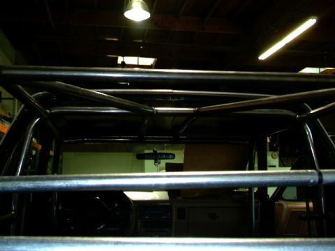 1989 Ford Bronco - Interior view of a vehicle's roll cage structure, obscuring most of the cabin.