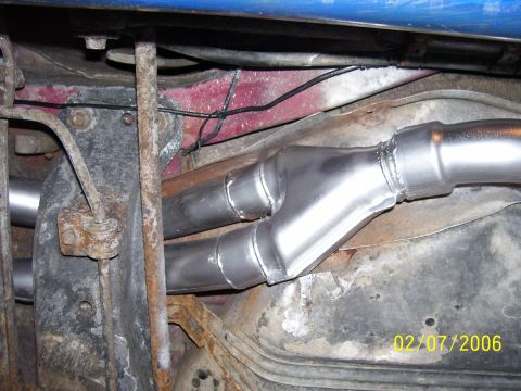 1994 Ford Probe - Undercarriage view of a dual exhaust system with a Y-pipe connection.