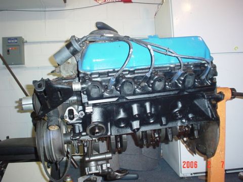 1979 Ford Bronco - A V8 engine is mounted on an engine stand, ready for work or display.