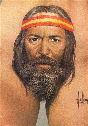 1989 Ford Bronco - A close-up portrait of a man's face, showing his facial hair and a headband.