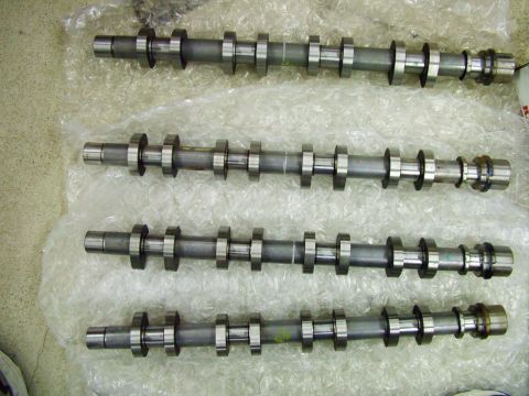 2003 Ford Mustang - Four camshafts are shown, likely for an engine rebuild or upgrade, resting on protective bubble wrap.