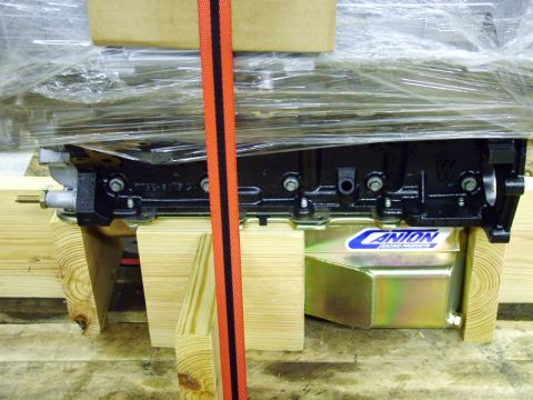 2003 Ford Mustang - Engine block and oil pan assembly, likely for a performance vehicle, secured for transport.