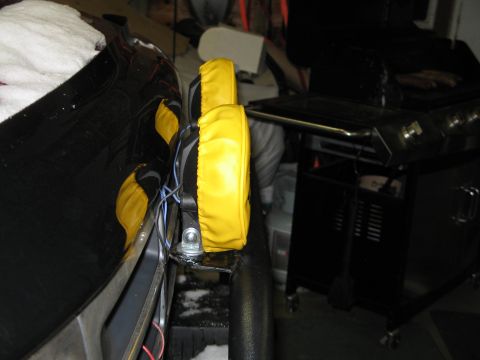 1995 Ford Bronco - Yellow covers protect the auxiliary lights mounted on the side of a vehicle.