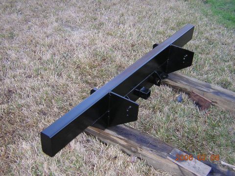1986 Chevrolet Blazer - Black metal bumper part shown outdoors on wooden beams. Date stamp reads 2006-02-08.