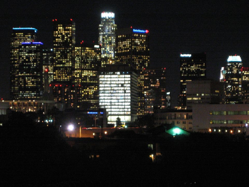 City skyline at night with illuminated buildings