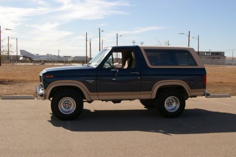 1986 Ford Bronco - This 1986 Ford Bronco, seen from the side, features a two-tone blue and tan paint scheme.