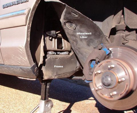1994 Ford Crown Victoria - To fix the leak, remove the RF wheel & peel the wheelwell liner forward. Clean & dry the area under the drain.
