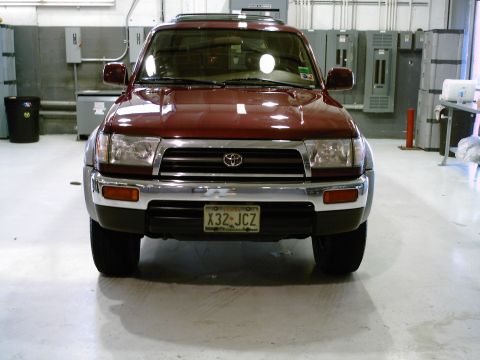 1996 Toyota 4Runner - Front view of a maroon 1996 Toyota 4Runner parked indoors.