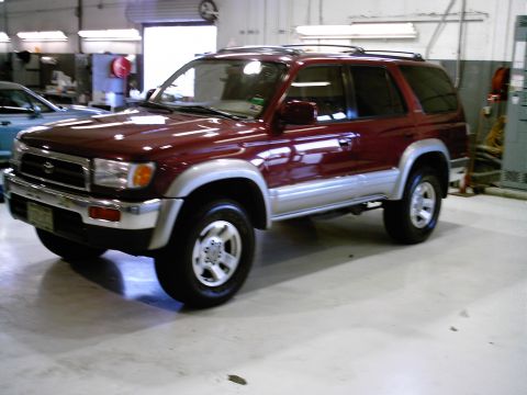 1996 Toyota 4Runner - Maroon 1996 Toyota 4Runner parked indoors, showing its 3q front profile.