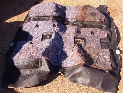 1994 Ford Crown Victoria - I pulled my carpet to dry it out. The passenger side (R in the photo) is wet & rusty from the leak on the firewall at the HVAC drain.