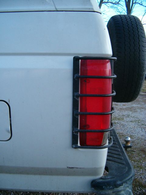 1995 Ford Bronco - Rear view of a 1995 Ford Bronco showing the tail light assembly and spare tire.