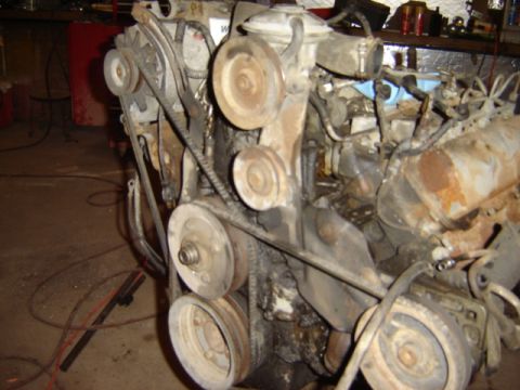 1992 Ford Bronco - Close-up view of a vehicle engine, showing the belts and pulleys.