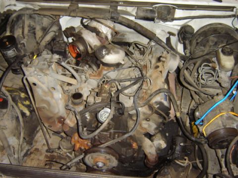 1992 Ford Bronco - Close-up view of a complex engine bay, showing various components and wiring.