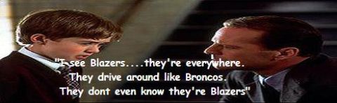 1970 Mercury Cougar - A scene from a movie or TV show two men and a text overlay discussing Blazers and Broncos.