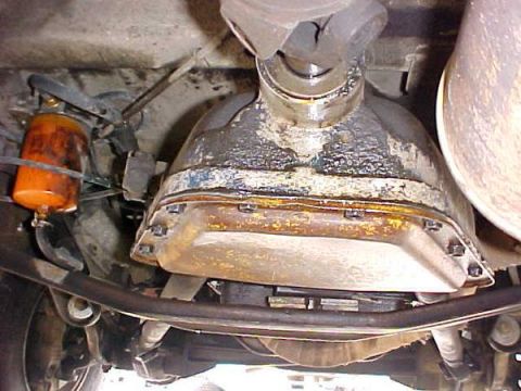 2000 Ford E350 - Underside view of a vehicle's transmission and fuel filter assembly.