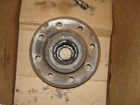 1978 Ford F-250 - A used wheel hub with visible grease and rust is shown in a cardboard box.