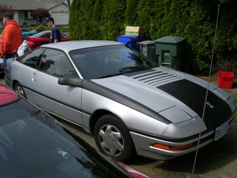 1996 Ford Probe - This 1996 Ford Probe is parked in a driveway with other vehicles present.