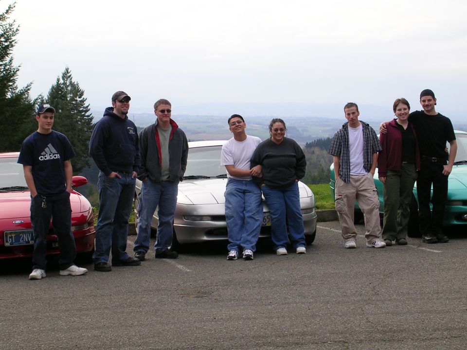 1996 Ford Probe in front of a group of people