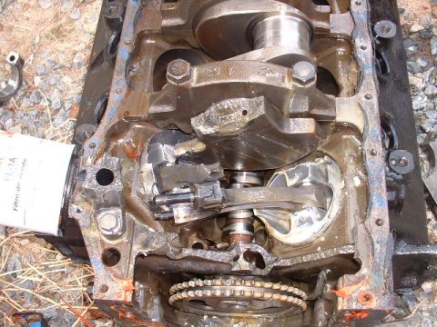 1969 Ford Mustang - Engine block shows severe internal damage to the crankshaft and connecting rods, indicating a catastrophic failure.