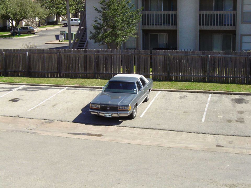 Gray 1988 Ford Crown Victoria LTD parked in a lot