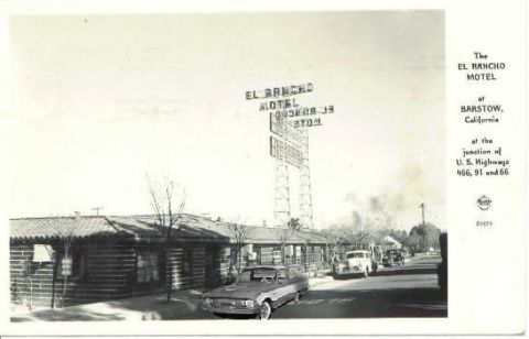 2002 Ford Crown Victoria - A vintage scene captures the El Rancho Motel in Barstow, California, with several cars parked and driving by.