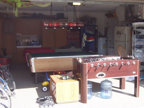 1993 Ford C-350 (Centurion Conversions) - A garage scene contains a pool table, foosball table, and various other items.