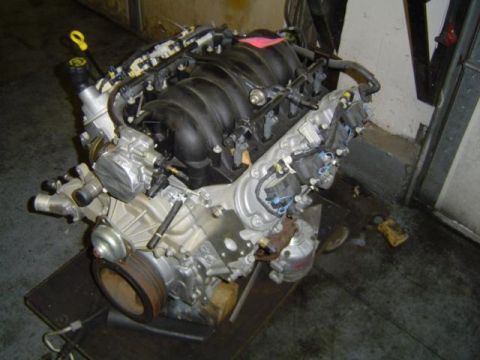 1979 Ford Bronco - Engine assembly with black intake manifold and silver block, likely a modern V8.